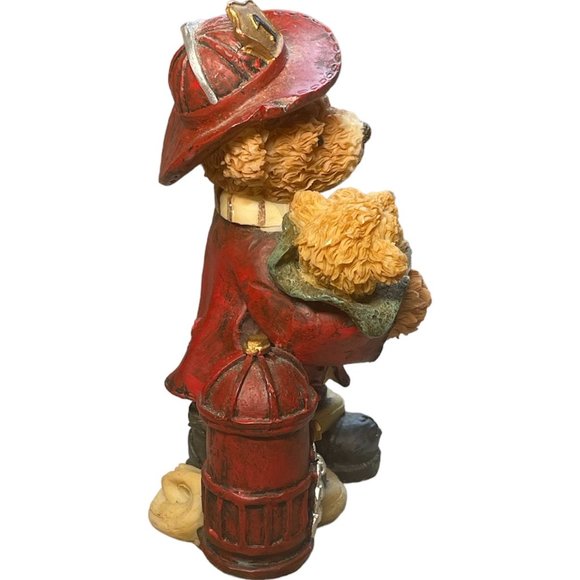 Fireman bear figure holding a baby bear - Picture 2 of 4